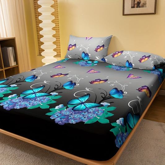 This fitted sheet features a soft and comfortable design with a floral and butterfly print in vibrant blue and purple colors on a black background. Made from 100% polyester, it has a deep pocket design for a perfect fit and is ideal for adding a touch of