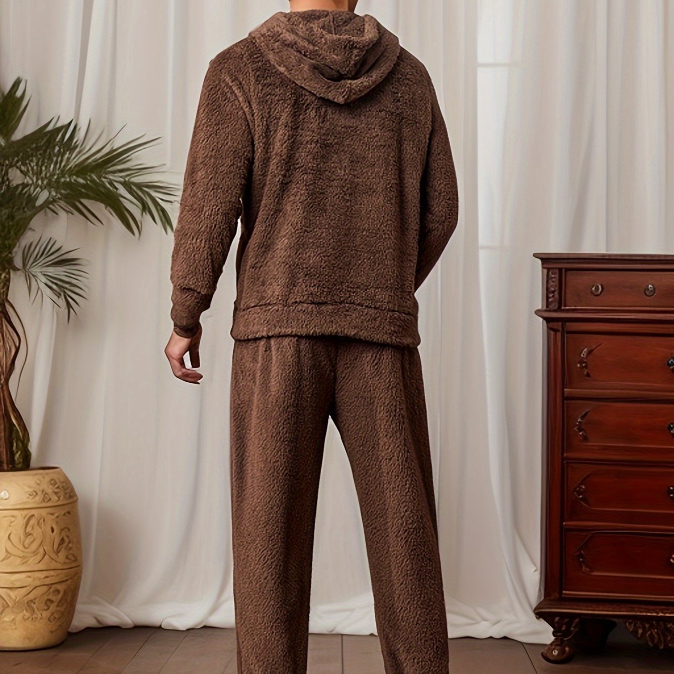 Cozy Men's Hooded Pajama Set made of plush fleece, with pockets and machine washable for winter sleepwear.