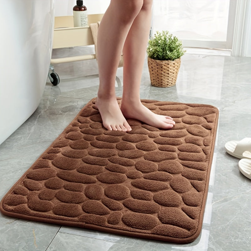 Soft, non-slip bath rug with excellent absorbency; machine washable with oblong shape and low pile.