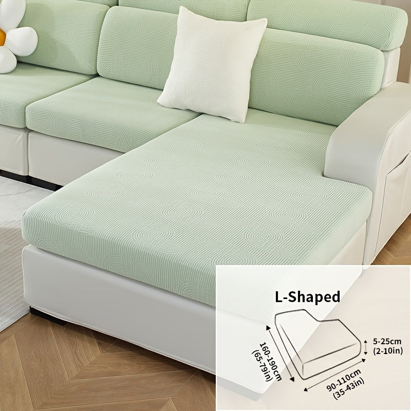 Jacquard sofa slipcover with universal fit and elastic design for furniture protection and home decor in any room.