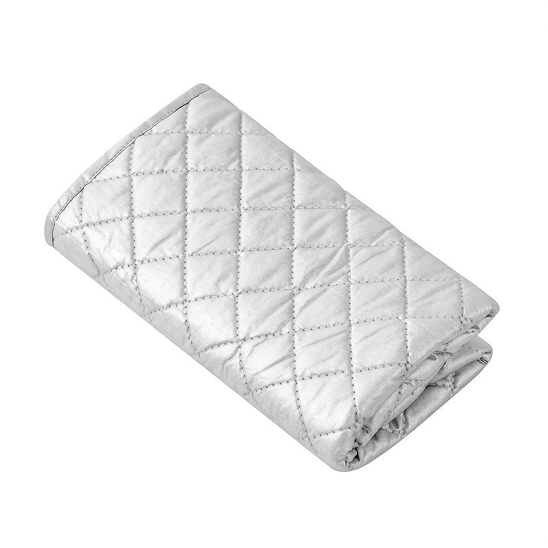 Portable ironing board with garment steaming capabilities, featuring heat insulation and high temperature resistance. This foldable mat is double-sided with a silvery, diamond lattice design for added style.