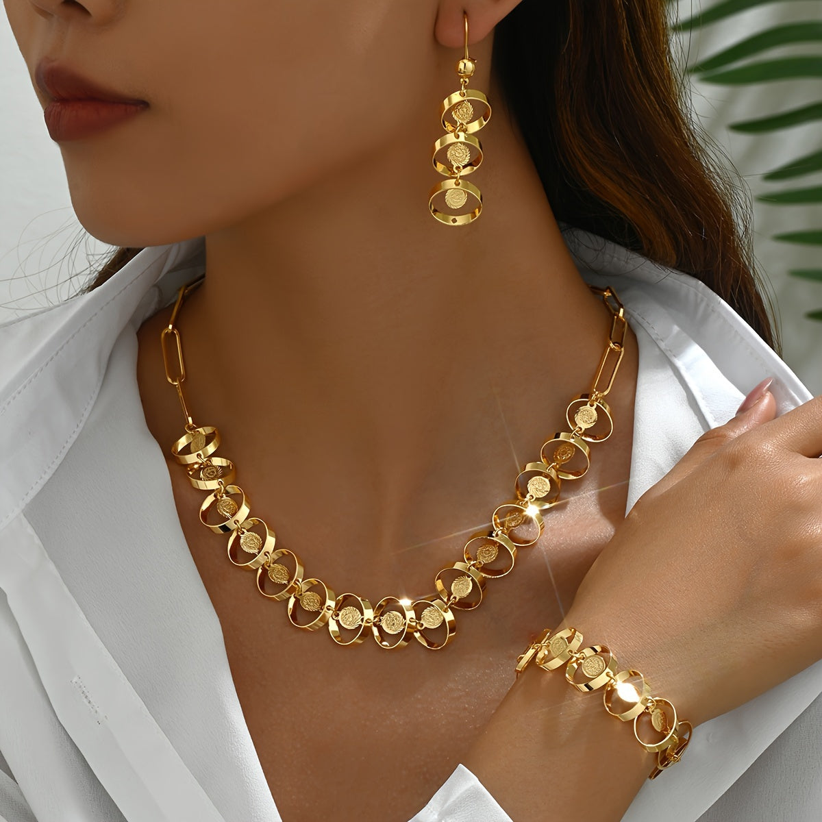 Set of four exquisite and elegant vintage-inspired women's jewelry pieces in 18K gold plating, perfect for a fashionable banquet. Includes a necklace, earrings, bracelet, and ornament.