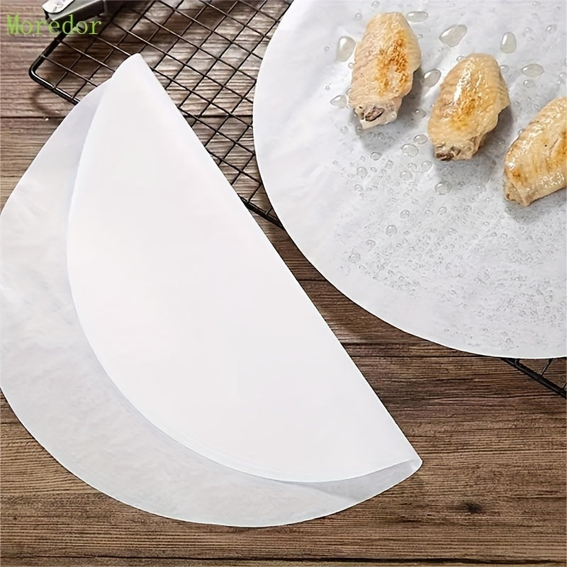 25cm round paper mats for 10'' cake pans, suitable for baking, grilling, steaming, microwave, and air fryer. Kitchen essential for non-stick baking.