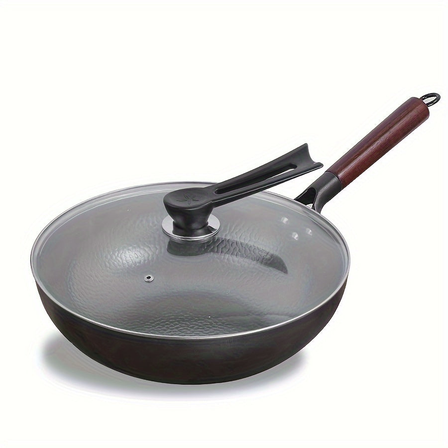 Traditional hand-forged 32cm/12.6in iron wok and stir-fry pan comes with a wooden lid. This non-coated, non-stick pan should be hand washed only. It features a durable cast iron handle and is compatible with smooth surface non-induction cooktops.