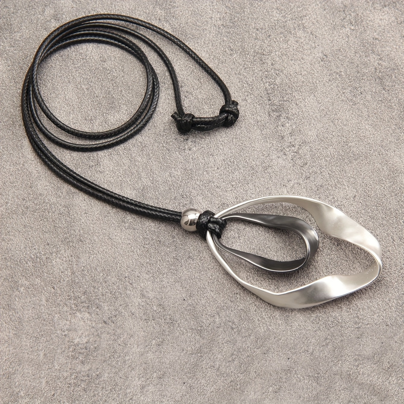 Stylish Twisted Teardrop Pendant Necklace for Women, made with Alloy featuring a Wide Edge Design. Includes a Simple Black Cord Long Chain, Perfect Romantic Gift for your Girlfriend. A Statement Jewelry Piece.