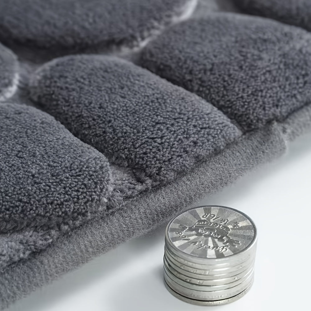 Upgrade your bathroom with the luxurious 1PC Pebble Embossed Memory Foam Bath Mat. This quick-drying carpet not only adds a touch of elegance to your living room but also provides a comfortable and washable non-slip surface for your bathroom. Elevate