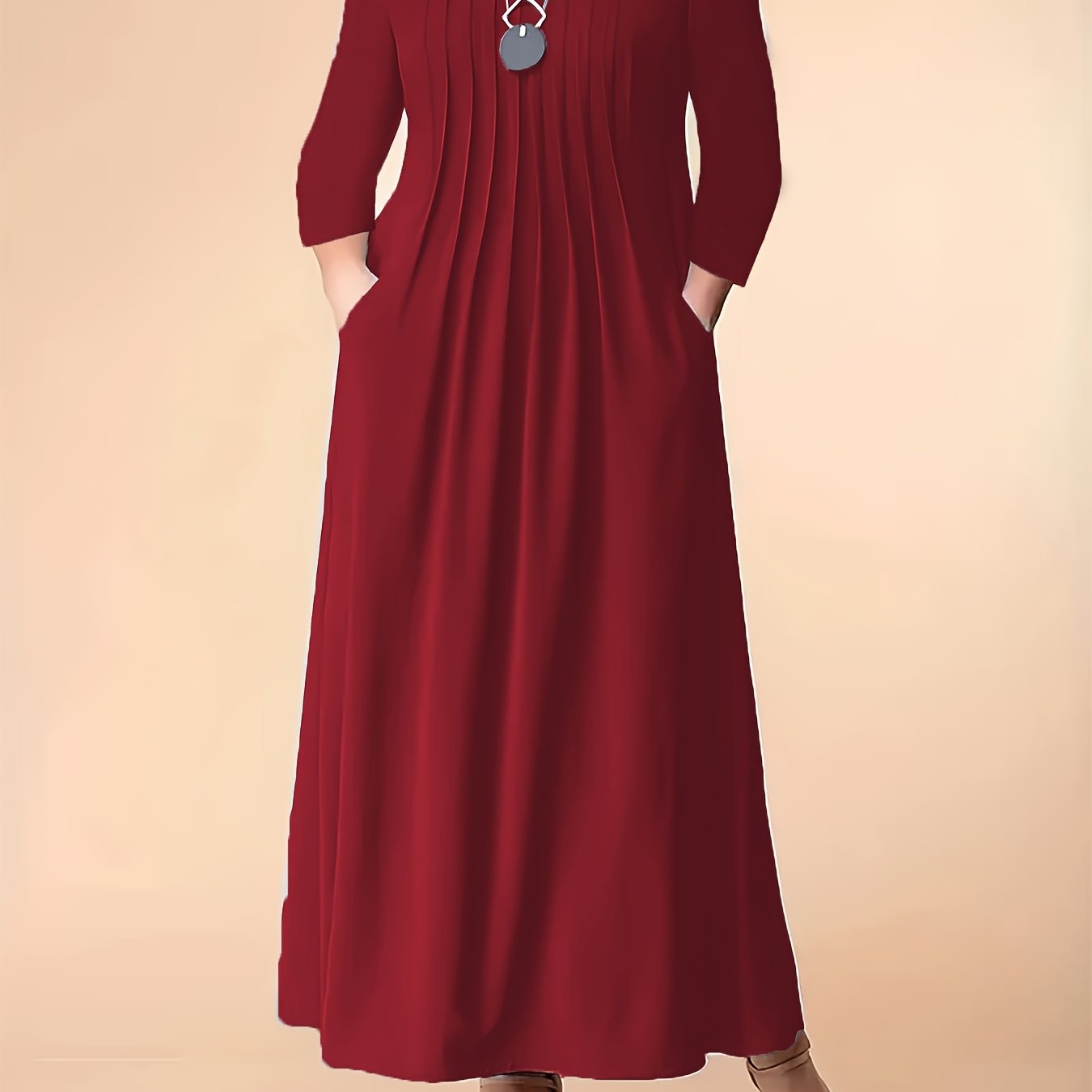 Stylish plus size red maxi dress for women with long sleeves, round neck, pockets, pleated detail, and stretchy polyester blend. Machine washable.