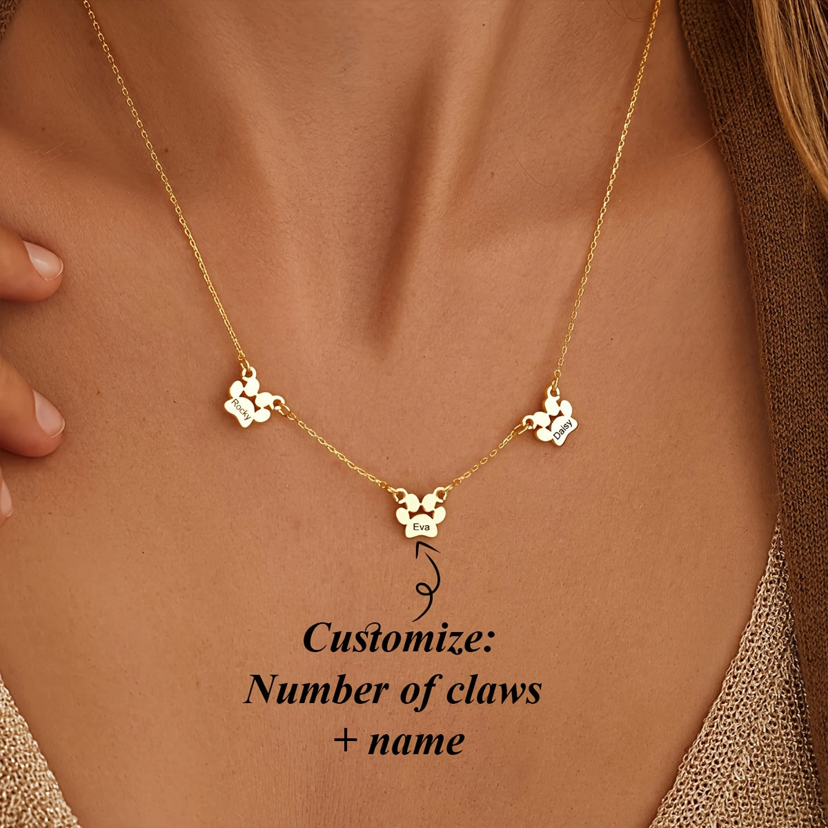 Get your hands on this exquisitely crafted 18K gold-plated copper pet paw necklace, featuring custom engraving of your pet's name and claws design. The cute and simple script and numeric symbols make it a stylish accessory perfect for everyday wear or