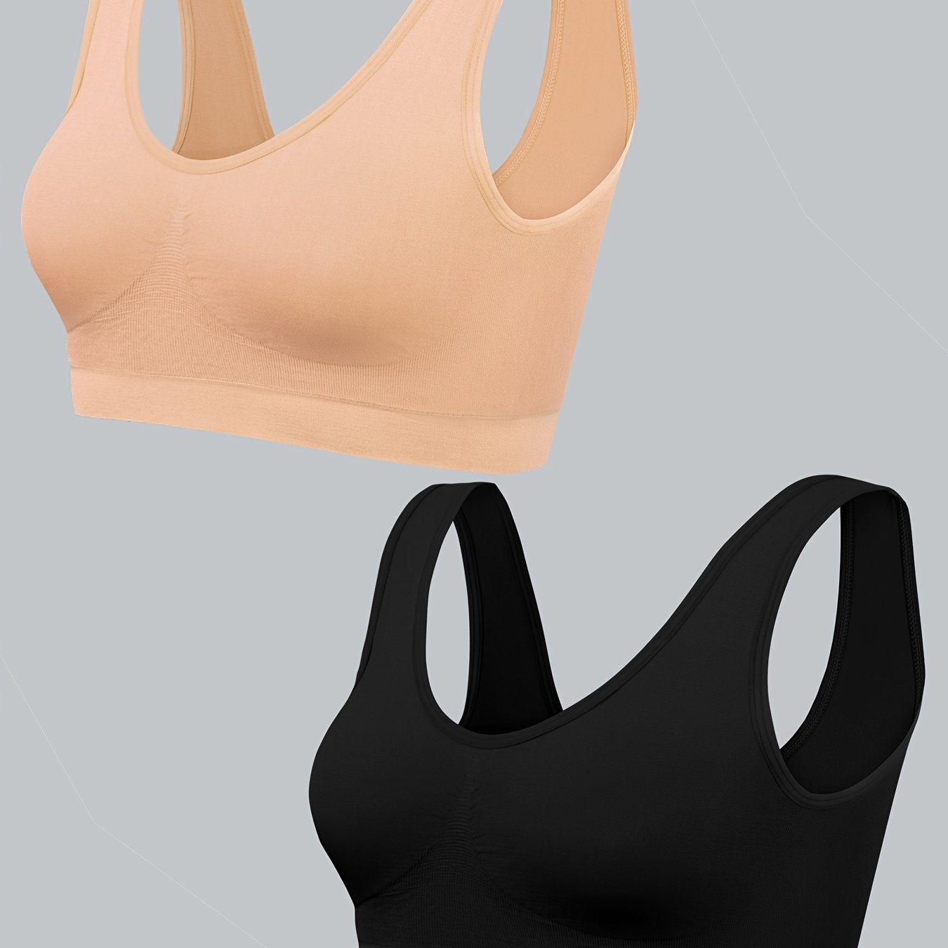 Two women's seamless, high elasticity sports bras made from solid color polyamide knit fabric. Offers high support and does not contain padding. Great for adult athletic activities.