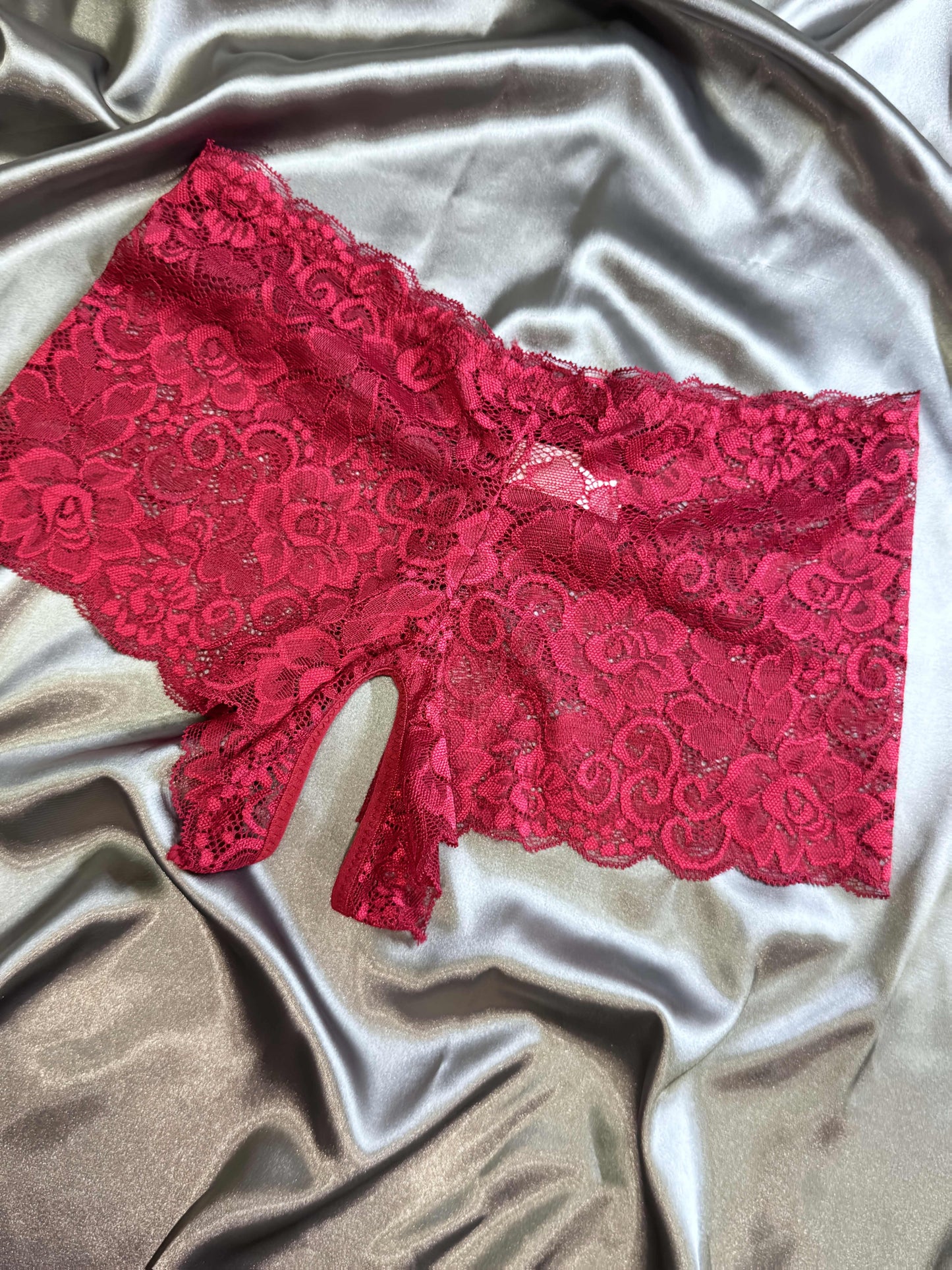 Valentine's Day lace open-crotch panties for women in red with bow details.