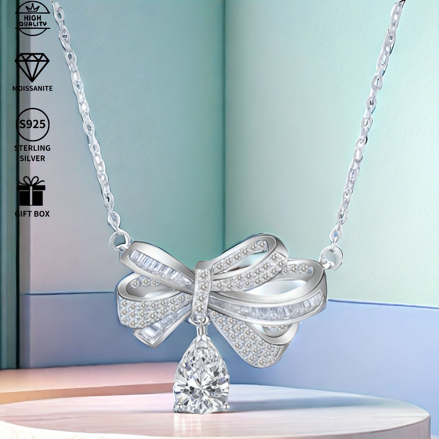 This elegant pendant necklace features 2.0 carats of moissanite in a teardrop tassel bow design, crafted in pure S925 silver. It is a high-end fashion accessory perfect for everyday wear, with its simple and elegant design suitable for parties and as a