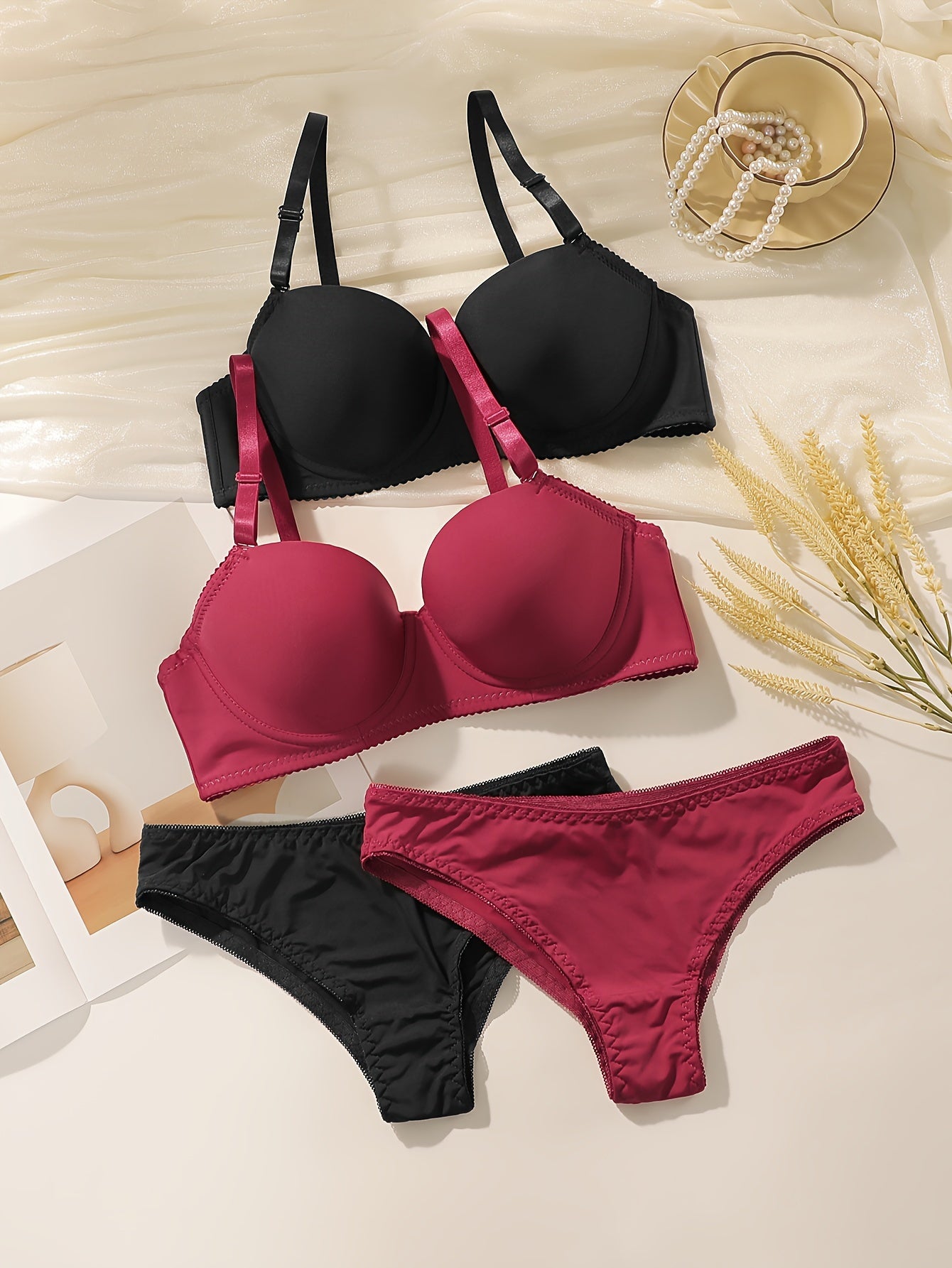 Women's 2-piece Seamless Push-Up Bra & Panty set with underwire support. Made of breathable nylon/elastane blend. Includes black and maroon styles. Hand washable.