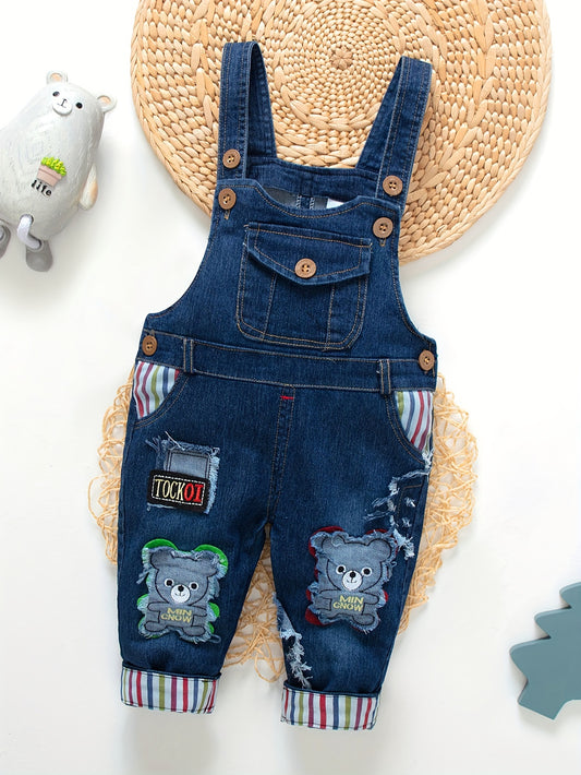 Children's denim overalls with embroidered animal designs, made of a cotton blend with slight stretch, suitable for outdoor wear in the spring and fall.