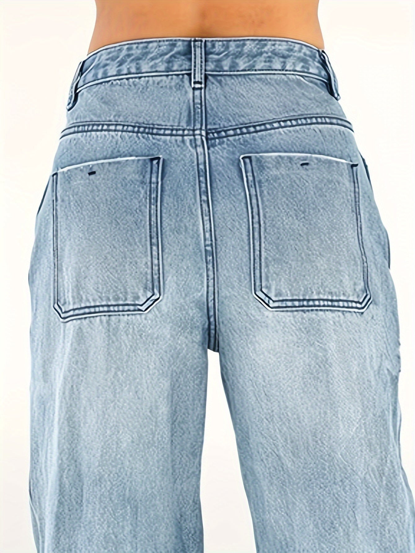 Women's wide leg jeans in plain washed blue denim, comfortable and classic design.