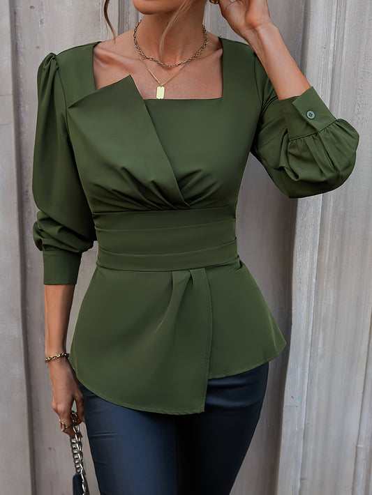 Sophisticated olive green blouse with square neckline, puffed sleeves, and asymmetric hem. Ideal for spring and summer, machine washable and dry cleanable.