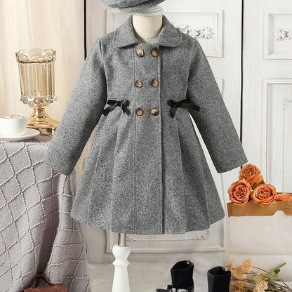 Youthful girls can look stylish in this casual polyester trench coat with lapel collar, double-breasted design, and matching bow detail and hat.