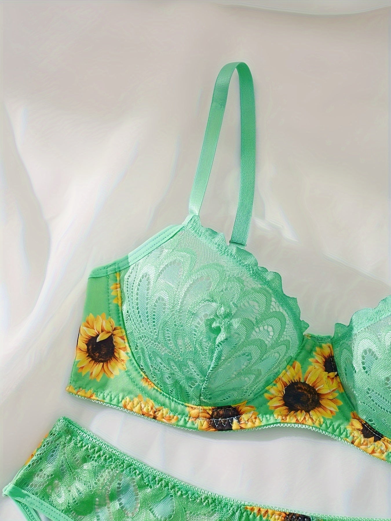 Floral lace bralette and briefs set for women.