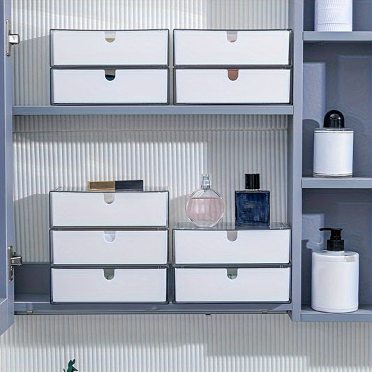 Cosmetics storage box with drawers, stackable design for bathroom and bedroom organization.