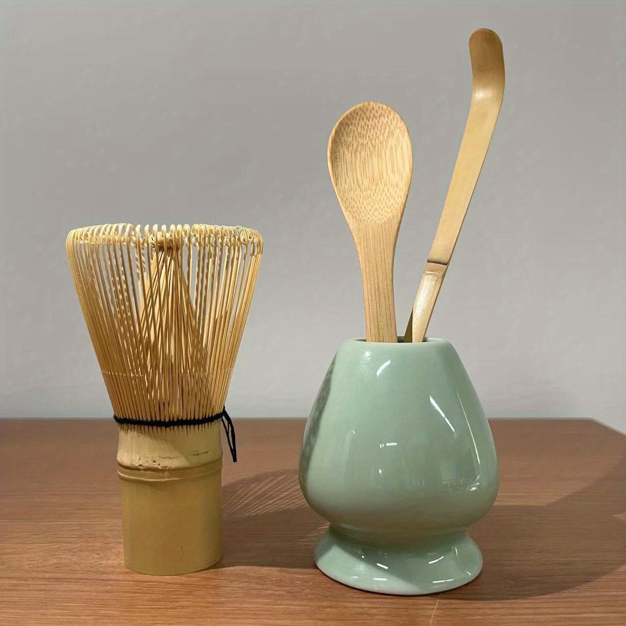 A set of 4 Japanese Matcha Ritual Accessories, including a Momonri Traditional Spoon, Tea Spoon, Matcha Egg Beater, and other accessories. This perfect set is ideal for preparing traditional Matcha. The set features a natural bamboo tea egg beater in