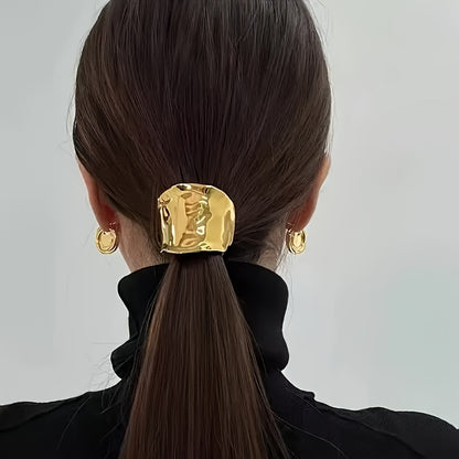 Customers love the elegant golden hairband, a fashionable ponytail holder that complements other golden accessories.