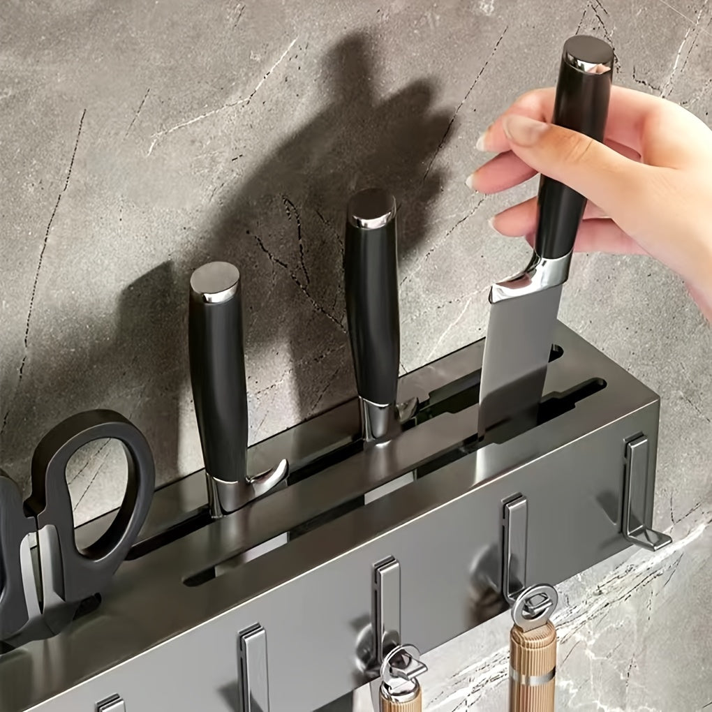 Wall-mounted carbon steel kitchen organizer featuring a no-drill design. This multi-functional rack is perfect for storing knives, forks, spoons, and chopsticks, with added features such as drainage and a towel holder.