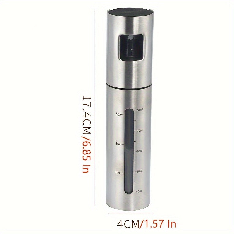 A 100ml stainless steel oil spray bottle for household kitchen use, perfect for seasoning and barbecuing with olive oil.