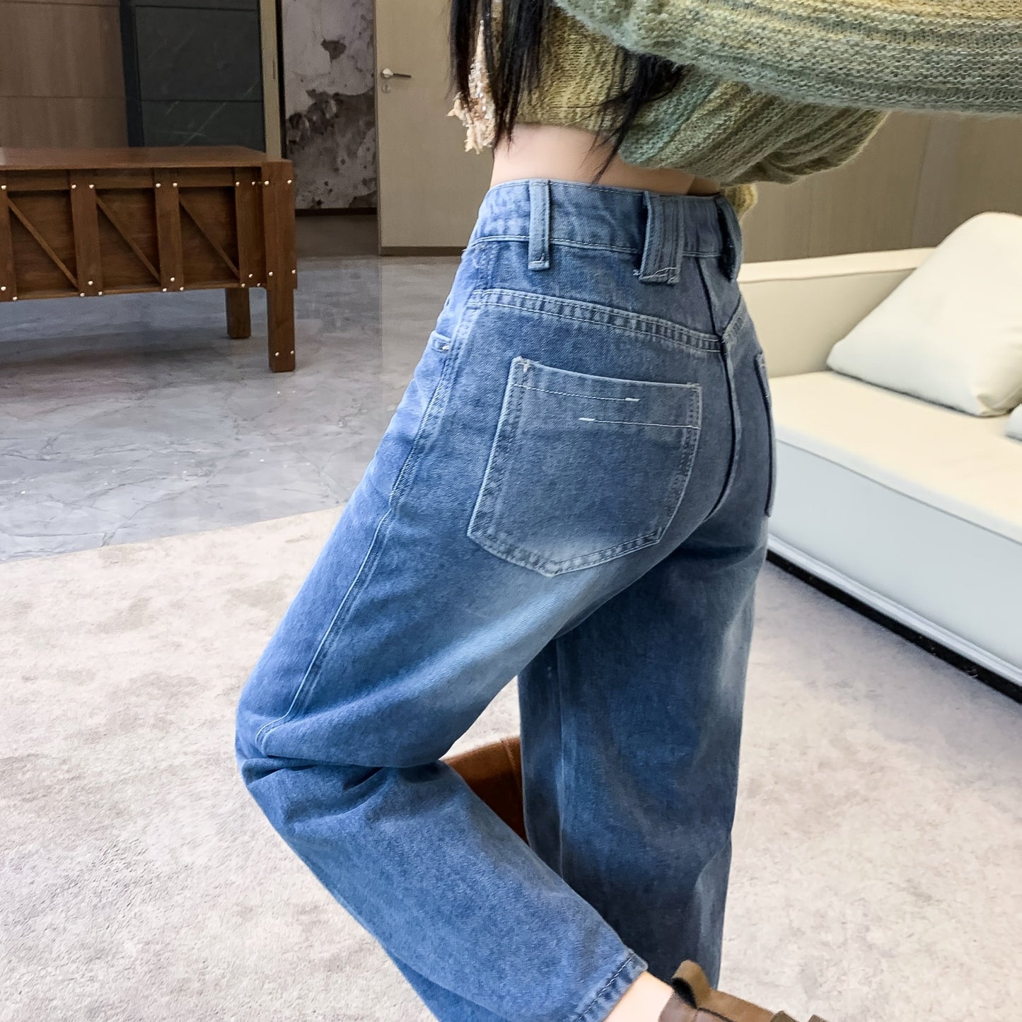 Retro wide-leg jeans with slant pockets for women. Stylish streetwear denim pants.