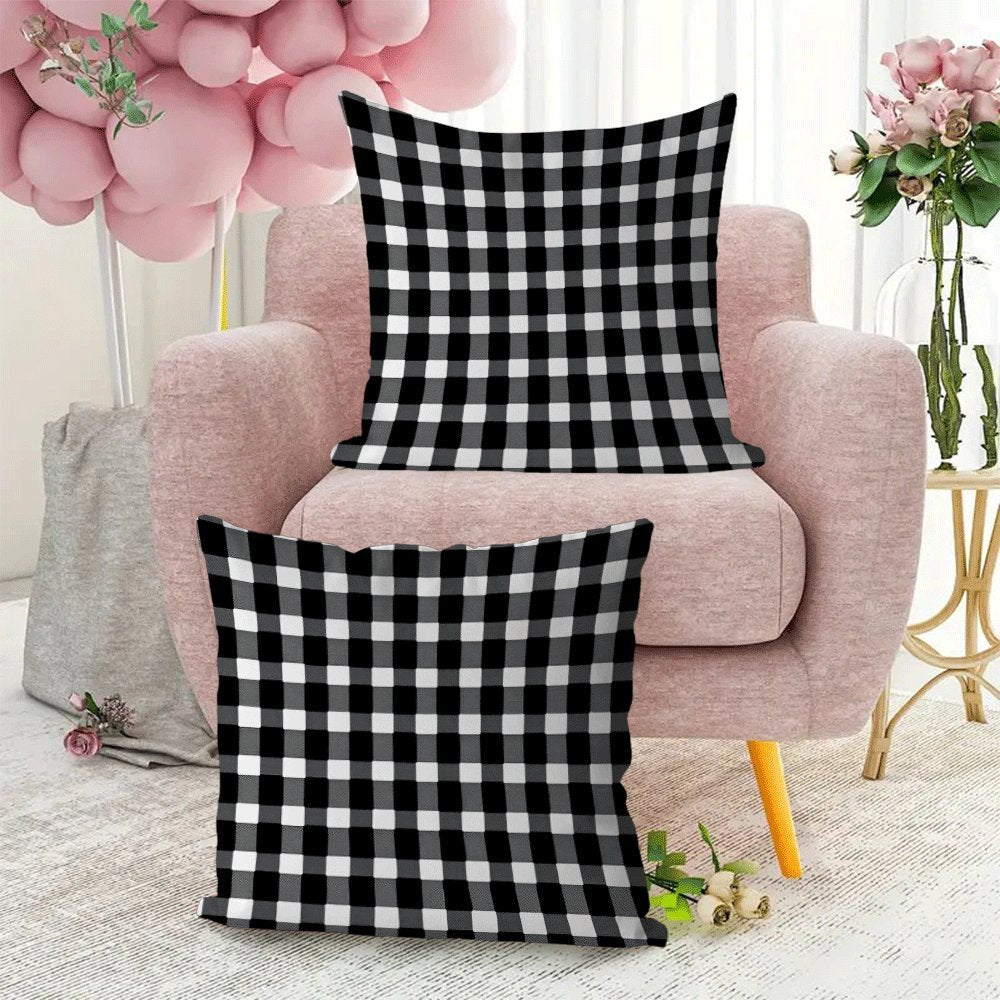 Two-pack of contemporary black and white checkered flannel pillow covers measuring 45.72x45.72 cm. These machine washable, zippered square cushion cases are perfect for use on your sofa, bed, or outdoor furniture in any season. Please note that pillow