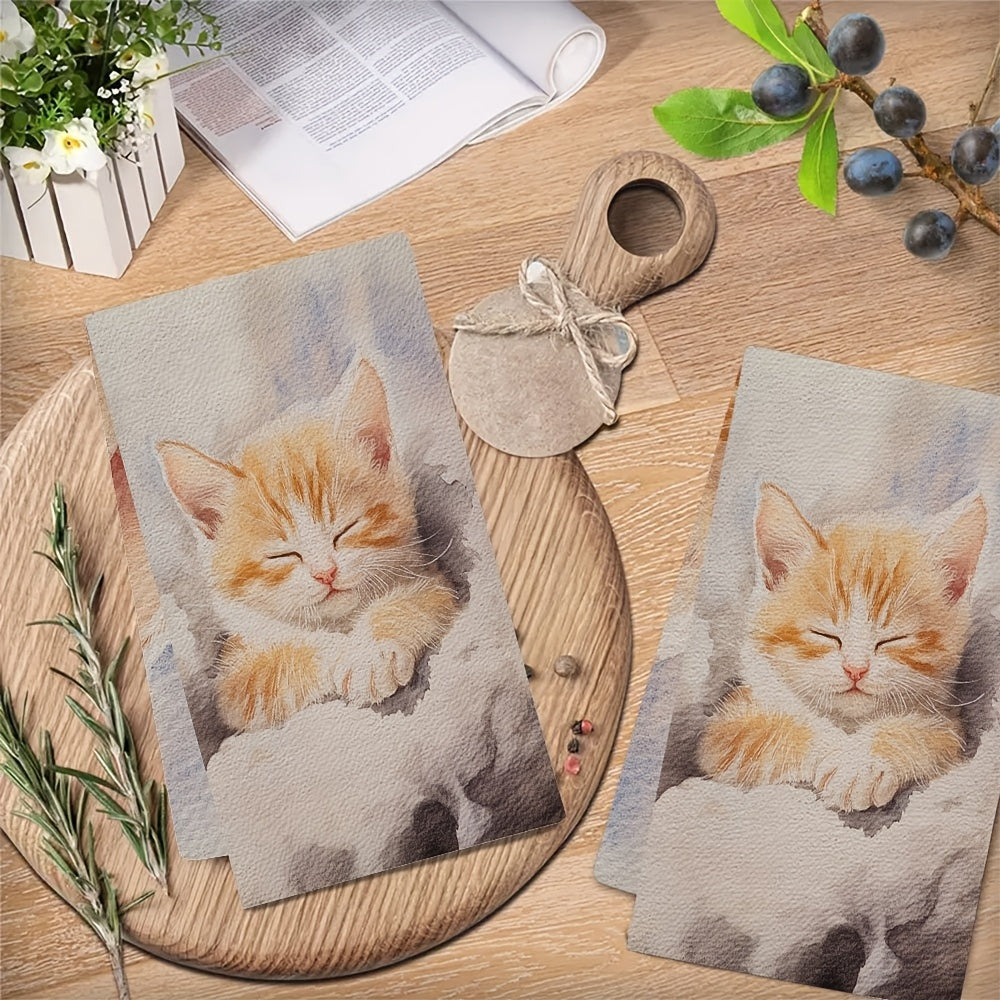 Two pieces of ultra soft kitchen towels featuring a charming kitten design. These highly absorbent towels are machine washable and perfect for use as dish hand towels. They are ideal for adding a festive touch to your holiday decor. Each towel measures