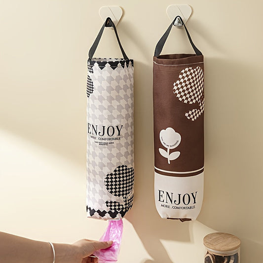 Wall-mounted dispenser made of PET material for garbage bags, serving as a kitchen organizer and waste bag holder. Versatile hanging storage pouch for home organization.