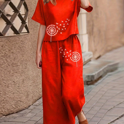 Boho dandelion print pajama set for women with loose fit, short sleeve top, and wide leg cropped pants.