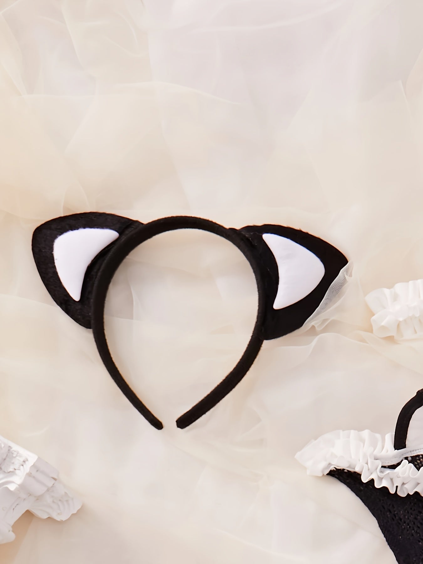 Sexy lingerie set includes headband, bow tie, clothing, gloves, and fishnet stockings.