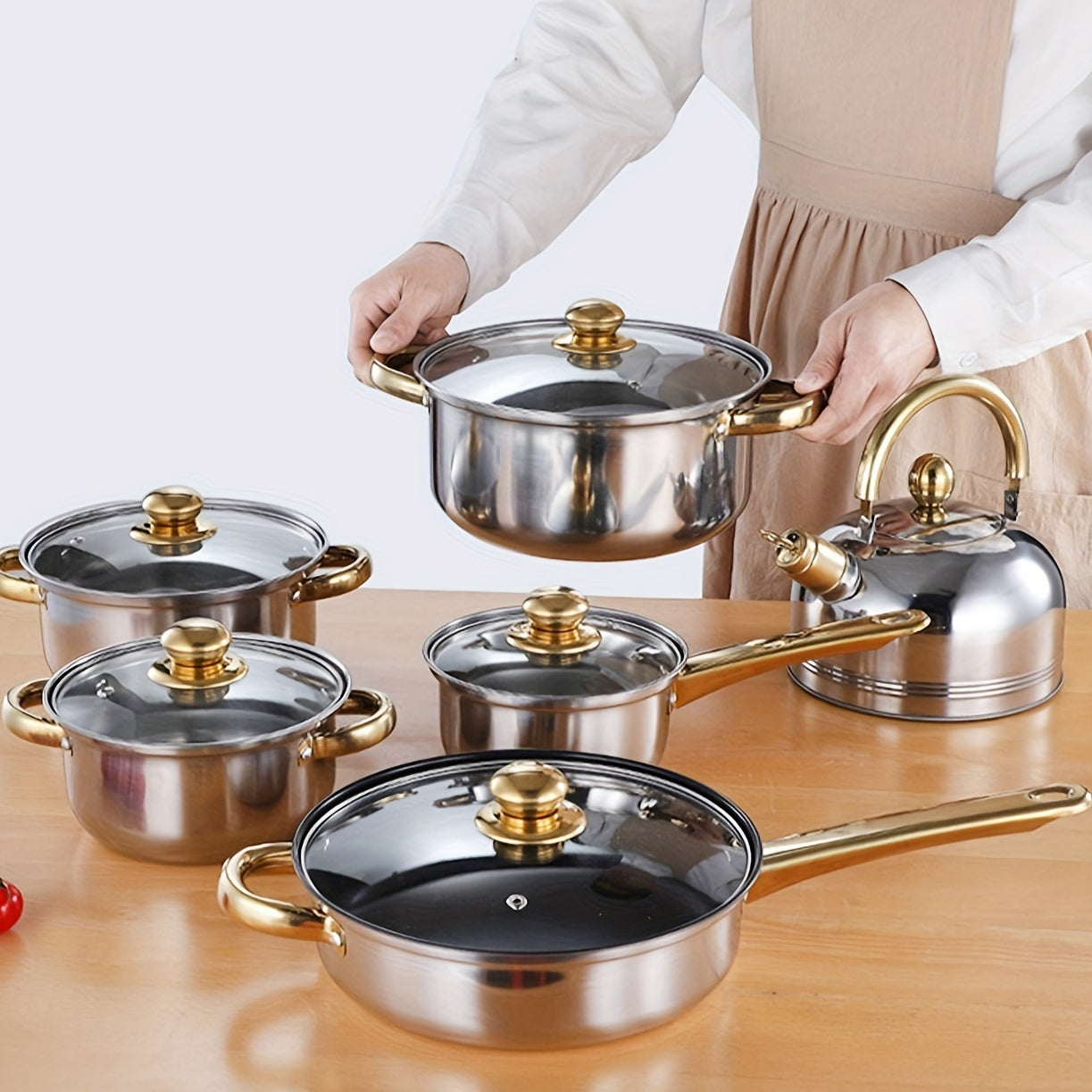 Upgrade your kitchen with the BAIJL 12-piece Stainless Steel Cookware Set featuring elegant golden handles. This set includes soup, milk, and frying pots as well as a kettle, perfect for both home kitchens and restaurants alike.