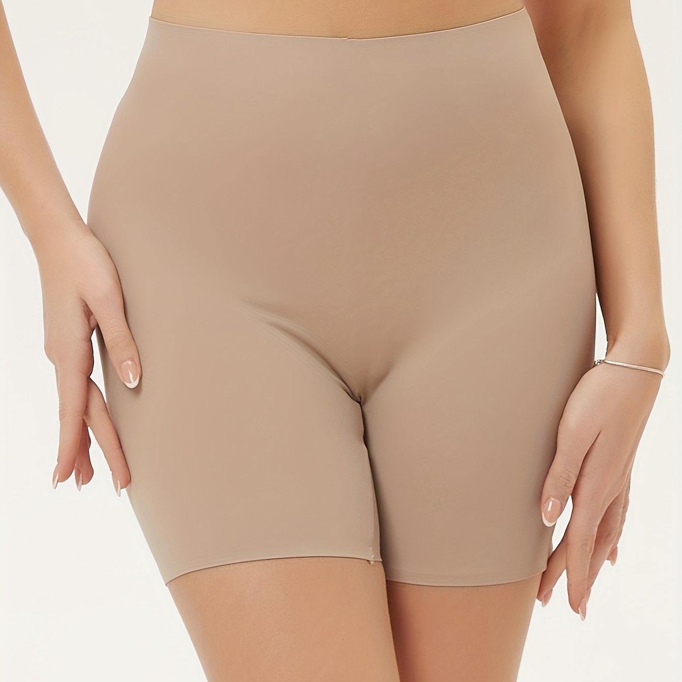 High waisted tummy control sports shorts for women that lift the butt and shape the body, made with breathable fabric.