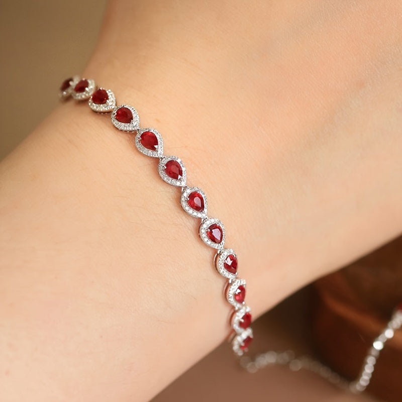 Stylish Sterling Silver Bracelet with Synthetic Red Gemstones and Celestial Theme, featuring zirconia Mosaic. This 925 Silver Plated Jewelry makes a perfect gift for December birthdays, special occasions, or Valentine's Day. A versatile fashion accessory