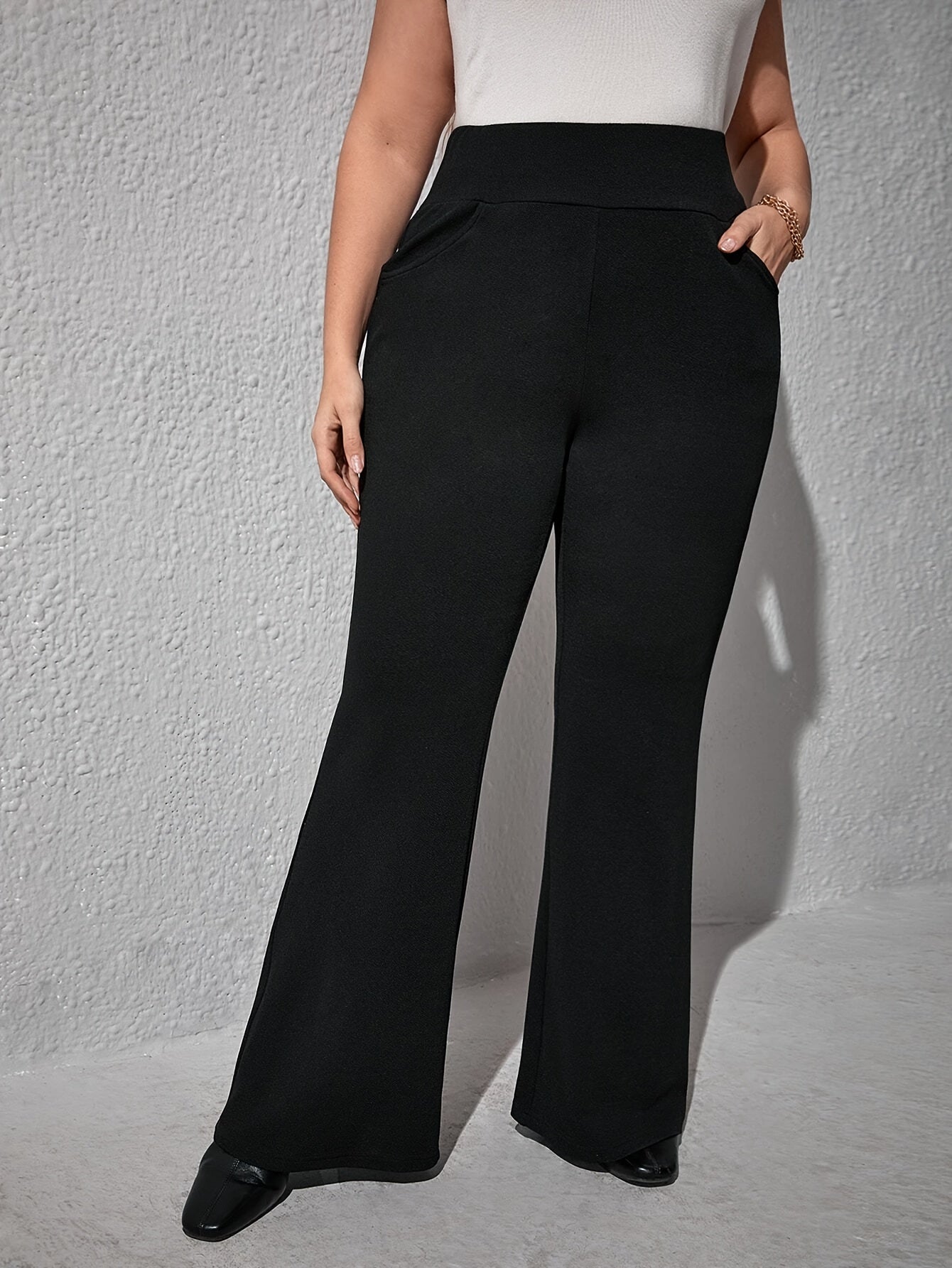 Elegant high-waist flare pants for plus size, with slant pockets, stretch knit, and machine washable - ideal for spring and fall.