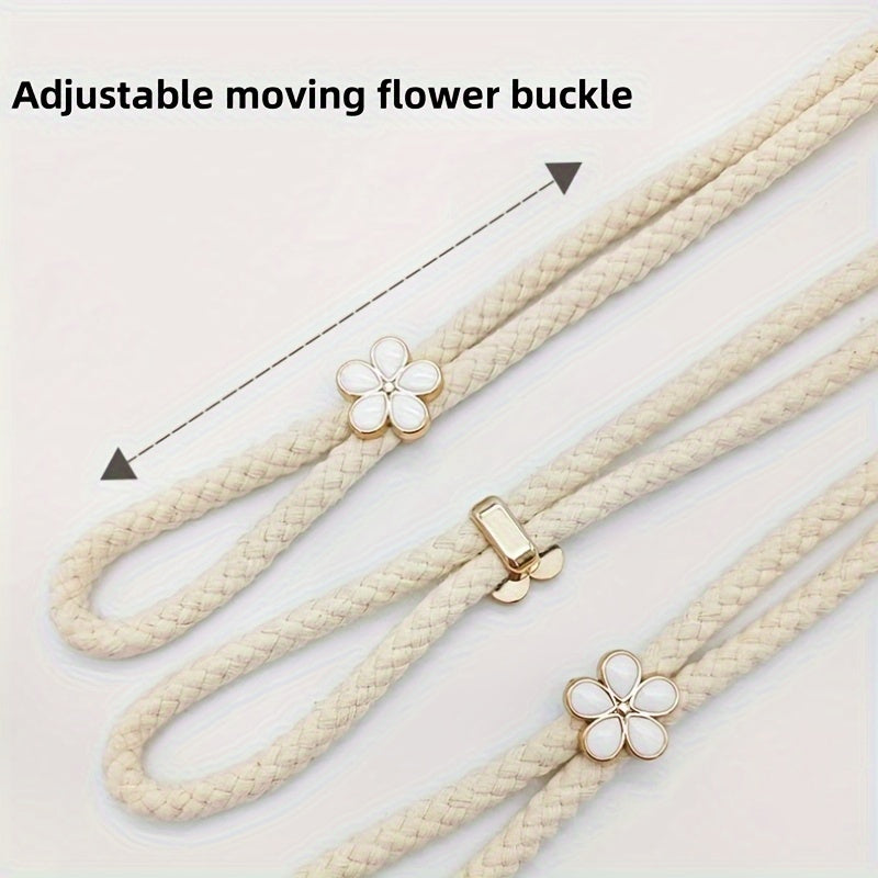 Two pieces of stylish adjustable curtain tiebacks with a modern floral buckle design and pearl accent. Made from polyester rope, these holders are perfect for adding an elegant touch to your window decor.