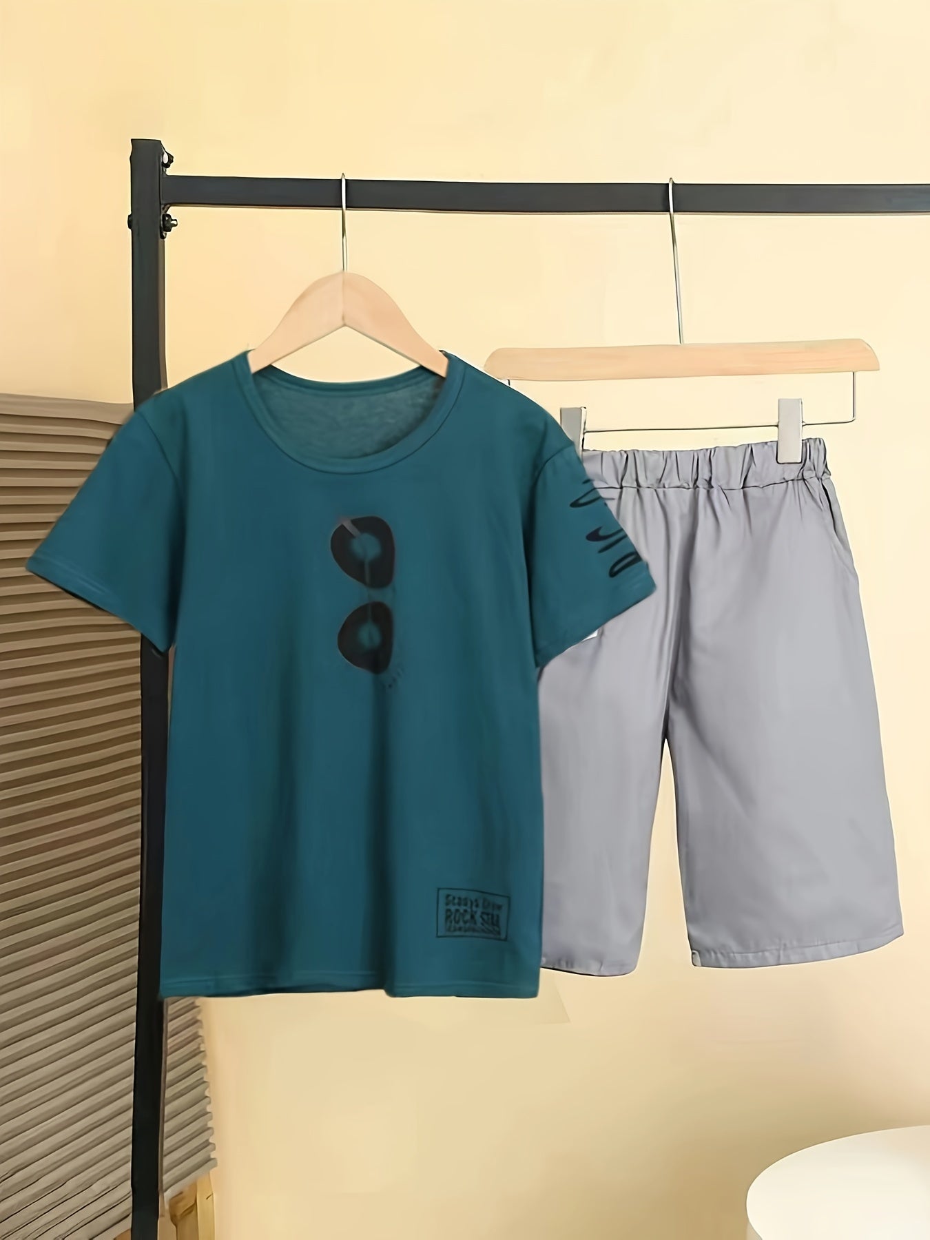 Boys' two-piece set with glasses print t-shirt and shorts, ideal for summer outdoor activities.