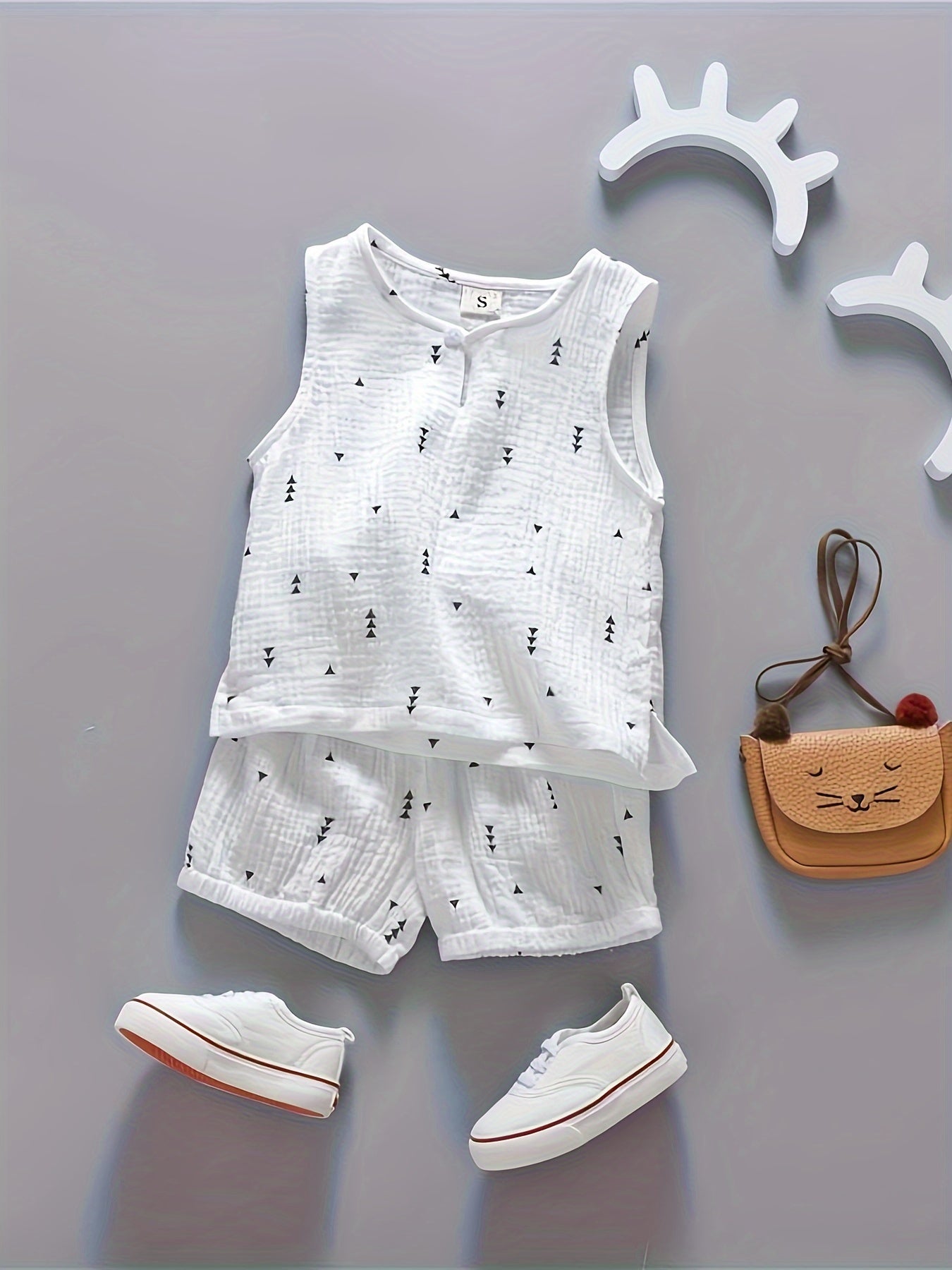 Boys' 2-piece cotton outfit with vest and elastic waist shorts for comfortable summer wear.