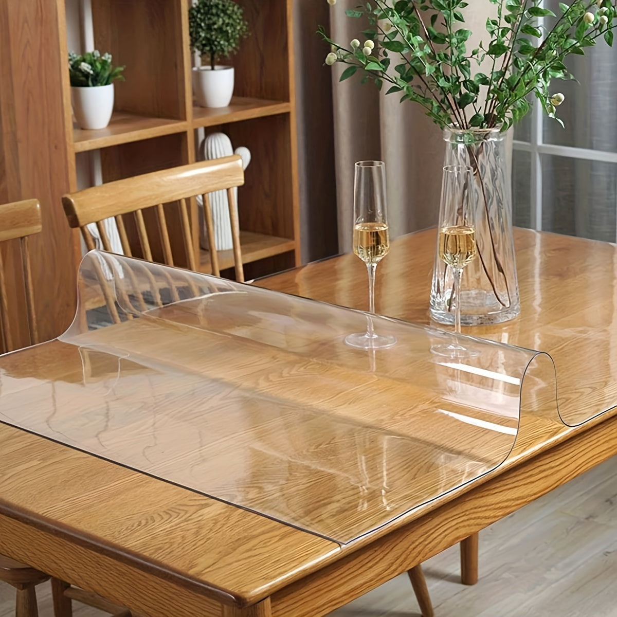 Thick and transparent tablecloth for home, hotel, and restaurant use, with anti-scratch and heat-resistant properties.