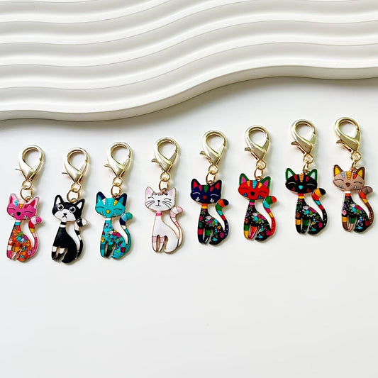 A collection of traditional cat-shaped keychains, 8 stylish zinc alloy keychains, whimsical cartoon animal pendants, perfect for embellishing handbags, car keys, and backpacks. Great for everyday use or as unique party favors for school events.