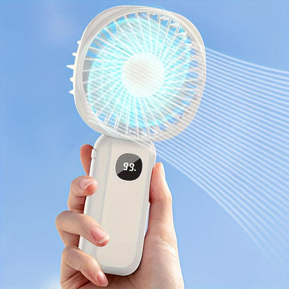 This portable handheld fan features a built-in battery capacity display and can be powered by USB or batteries. It also doubles as a convenient phone holder and is compact and easy to transport. Perfect for both handheld and desktop use, this fan is a