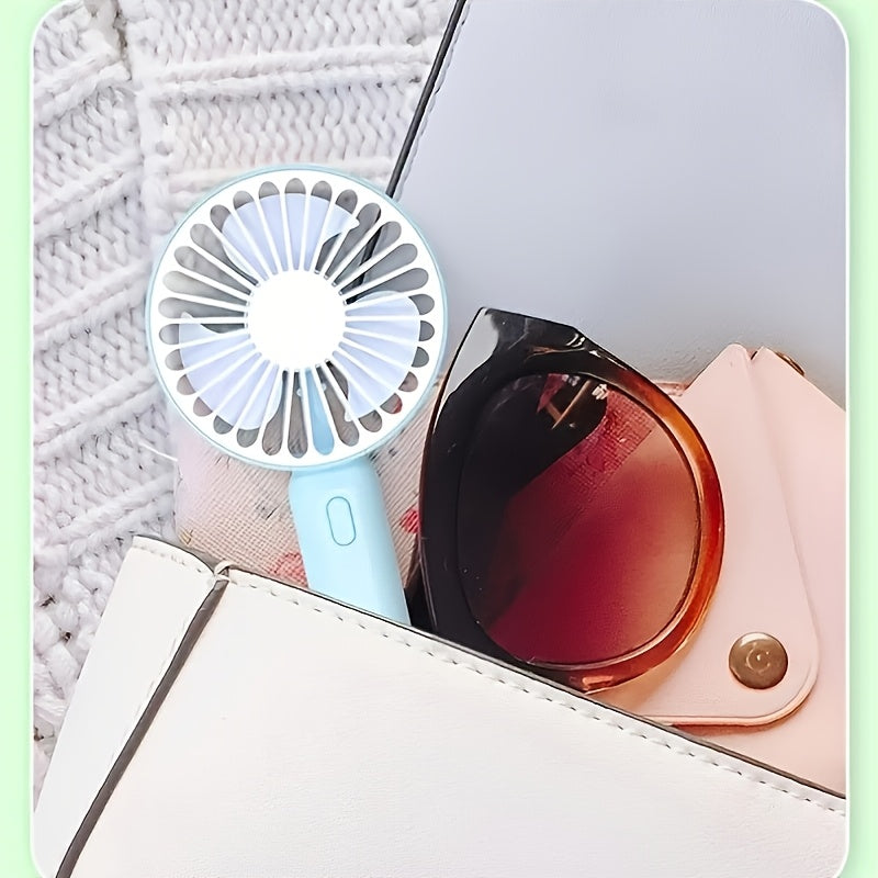 TOOP Portable Handheld USB Mini Fan with Phone Holder is a convenient and versatile personal fan with a high-speed feature, button control, and durable plastic construction suitable for indoor and outdoor use. With air circulation recommended, it