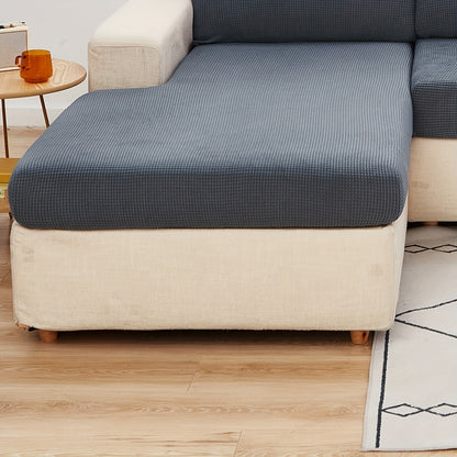 Durable sofa cover protects furniture from spills and stains.