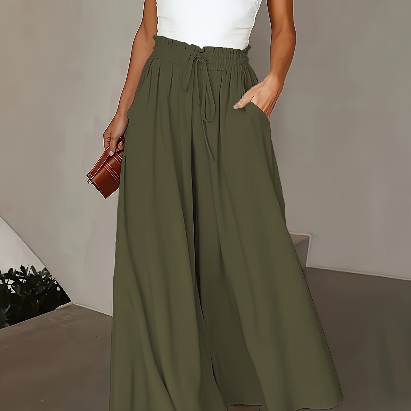 Olive green wide-leg pants for plus size women with high-rise and drawstring waist. Flowy straight cut, machine washable, comfortable for all seasons. Elegant casual style with smooth