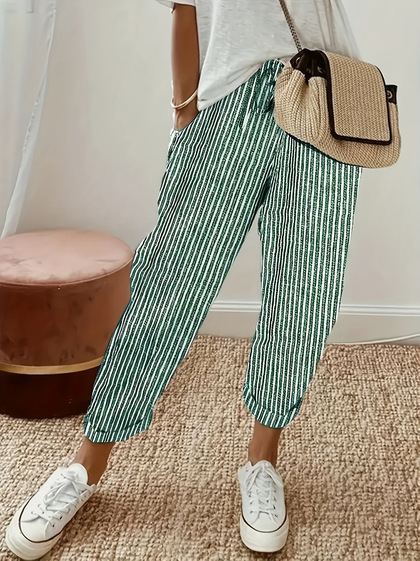 High-waisted, striped wide-leg pants for women made of lightweight polyester. Machine washable with side stripe detail for all-season comfort.