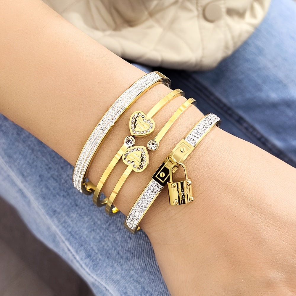 Stylish set of 3 stainless steel bracelets for women, plated in 18K gold with a heart-shaped pendant adorned with sparkling synthetic zirconia. The perfect luxury gift for weddings, parties, and Christmas, suitable for all seasons.