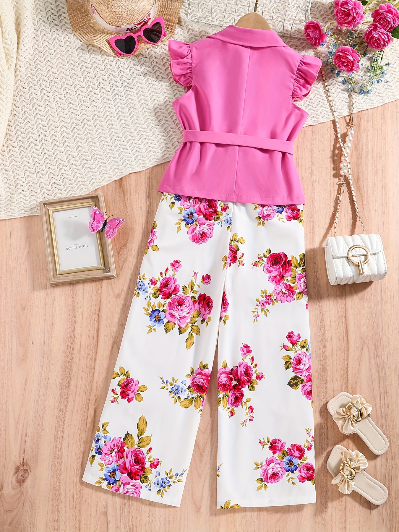 Girls spring/summer set featuring small flying sleeves, large turn-up collar, belt, floral top, and suspender leggings. Ideal for outdoor wear.