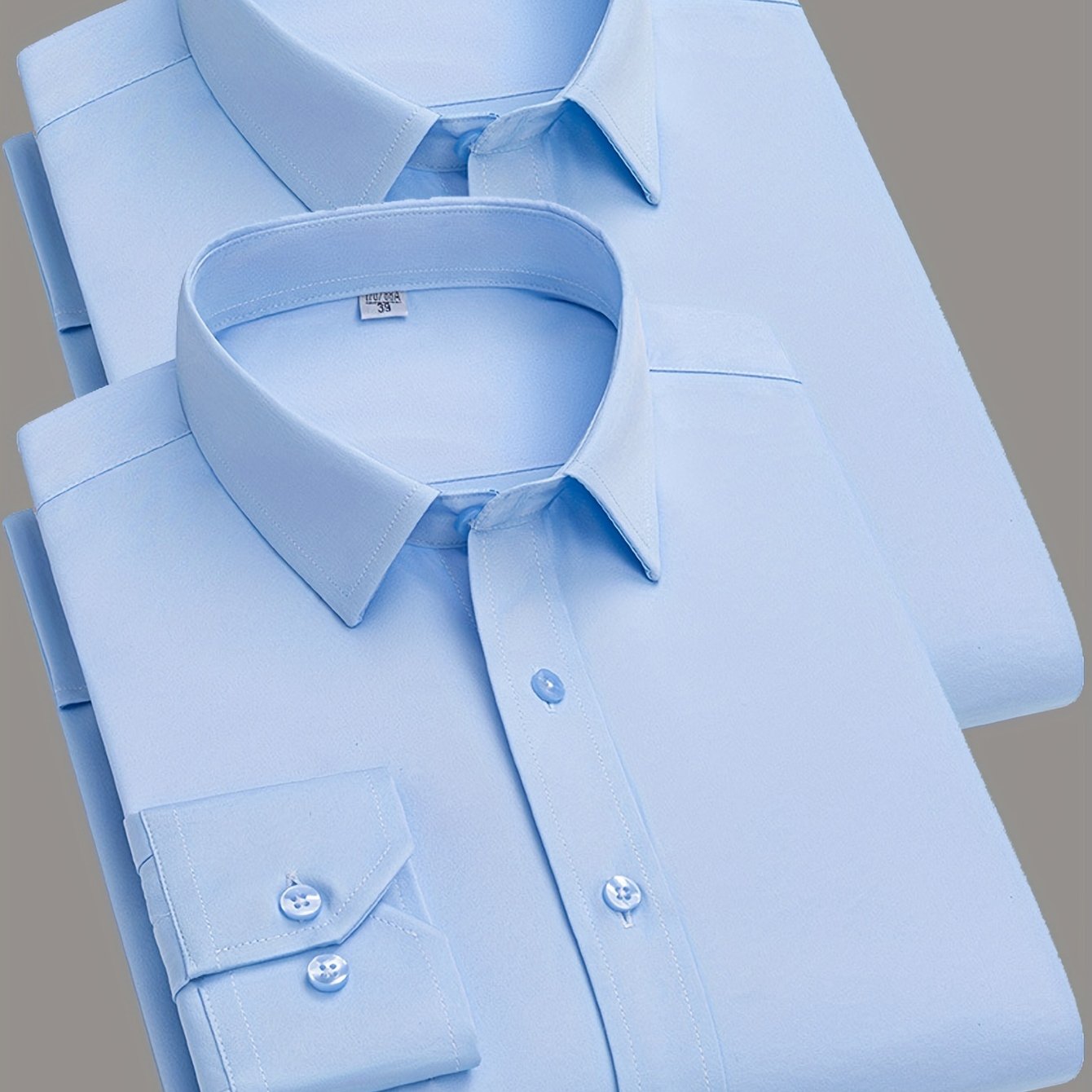 2 Men's work style polyester dress shirts in solid colors, regular fit with button details and lapel collar.