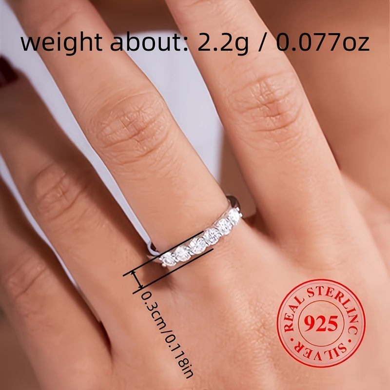 High quality gift for a special person, this 925 Sterling Silver Eternity Ring features a line of sparkling zirconia, perfect for engagement or wedding.